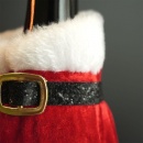 Pokrowiec świąteczny na butelkę wina nalewkę alkohol etui prezent ubranko Mikołaj święta 22,5 cm